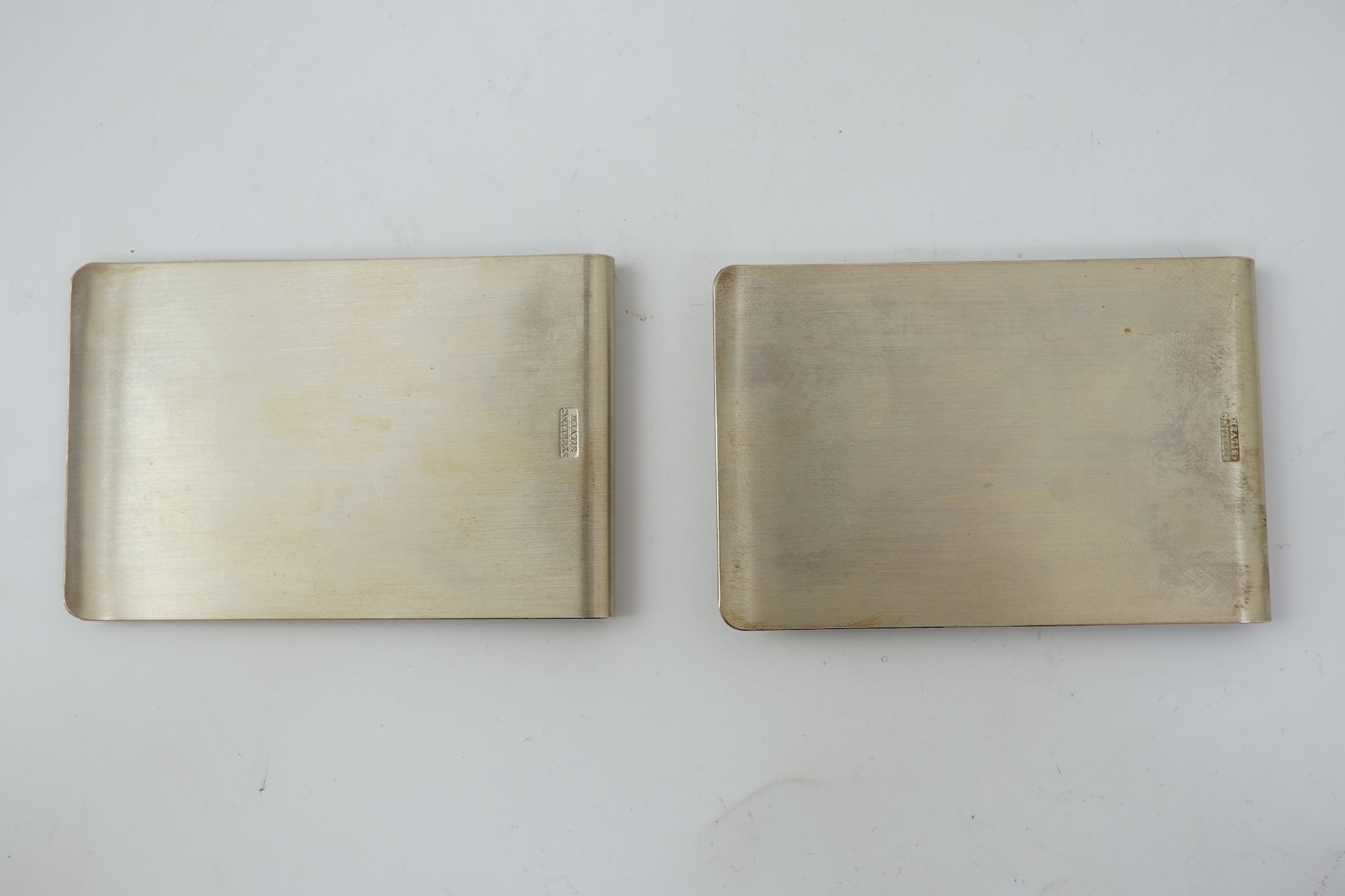 A pair of Elizabeth II silver money clips by Adrian Gerald Benney